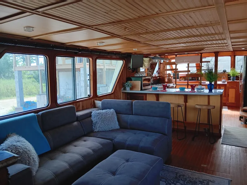 Slide: The Image of Luxurious interior of 1989 DeFever 57 POC Motor Yacht with cozy seating and elegant decor. - 21