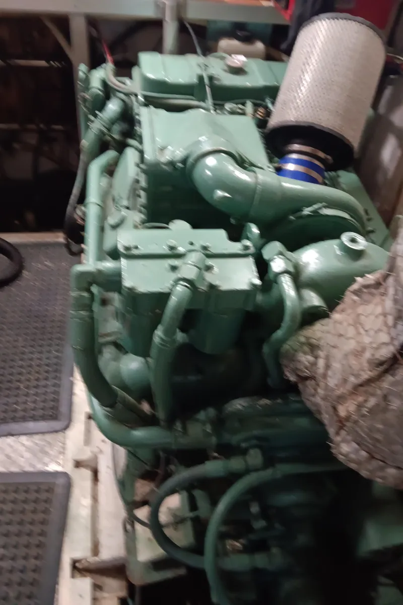 Slide: The Image of Engine room of 1989 DeFever 57 POC Motor Yacht with visible green engine components. - 35