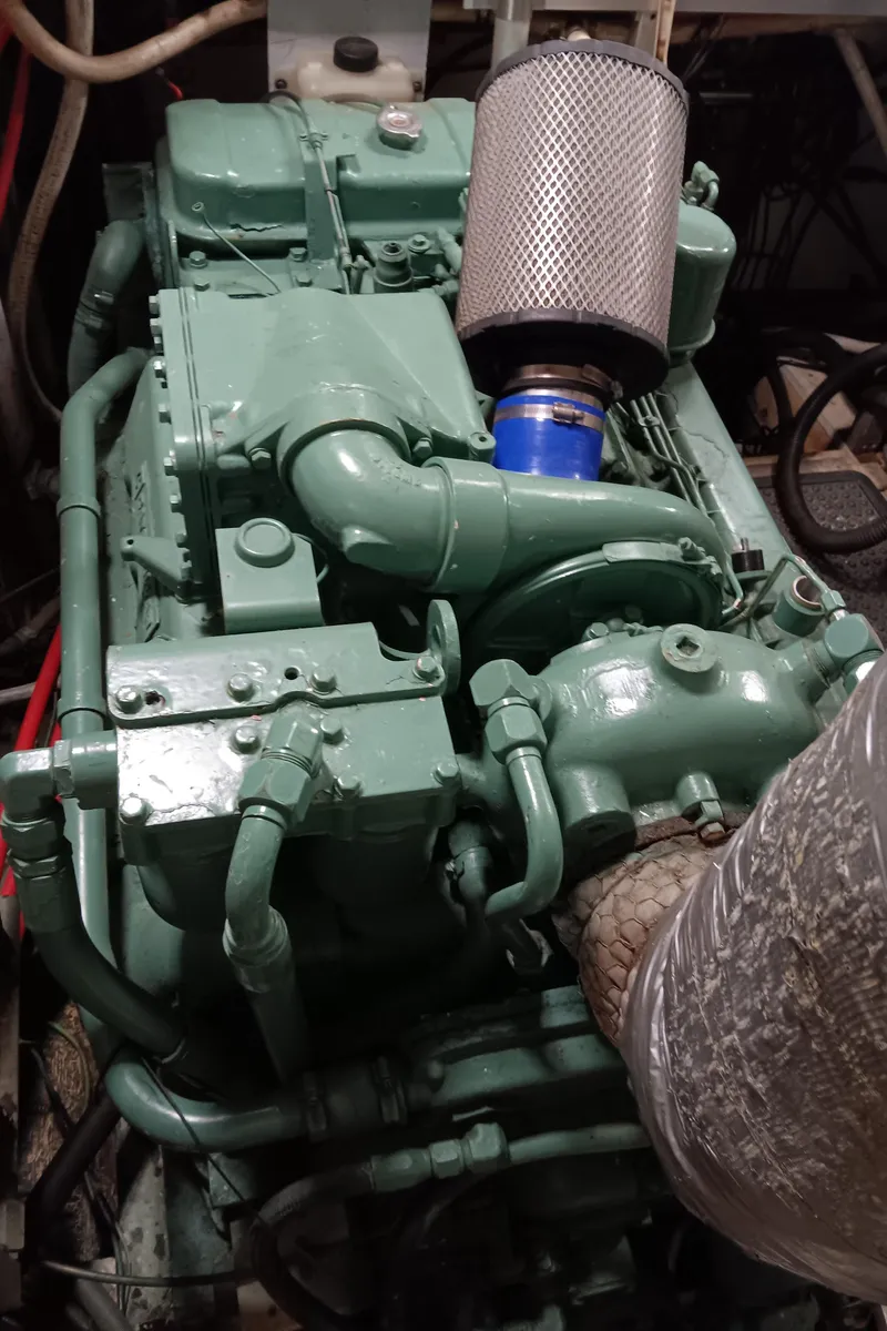 Slide: The Image of Engine room of 1989 DeFever 57 POC Motor Yacht with green machinery and air filter. - 36
