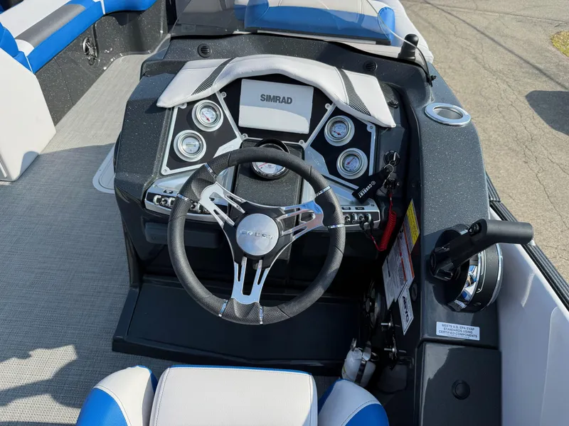Slide: The Image of 2023 Crest Caribbean RS 230 boat dashboard with steering wheel and control panel. - 6