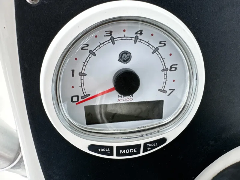 Slide: The Image of Tachometer of 2017 Mako 214 CC boat, displaying RPM with mode and troll buttons. - 14