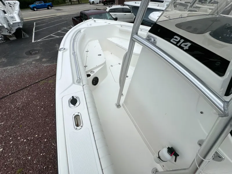 Slide: The Image of 2017 Mako 214 CC boat interior with white deck and railing. - 9