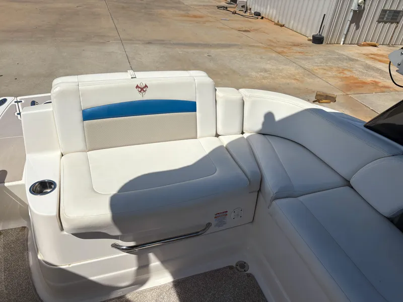 Slide: The Image of 2012 Chaparral 244 Xtreme boat interior with white leather seating and cup holder. - 7