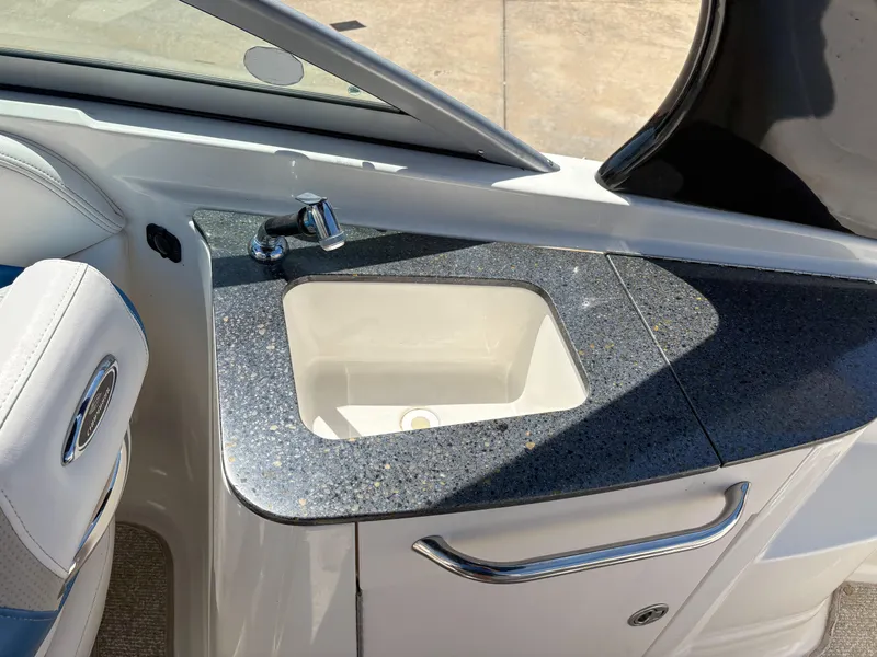 Slide: The Image of 2012 Chaparral 244 Xtreme boat interior with sink and countertop detail. - 9