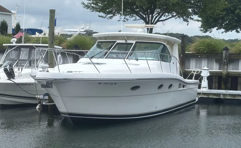 The Image of 2008 Tiara Yachts 3600 Open docked in a marina, surrounded by other boats. - 0