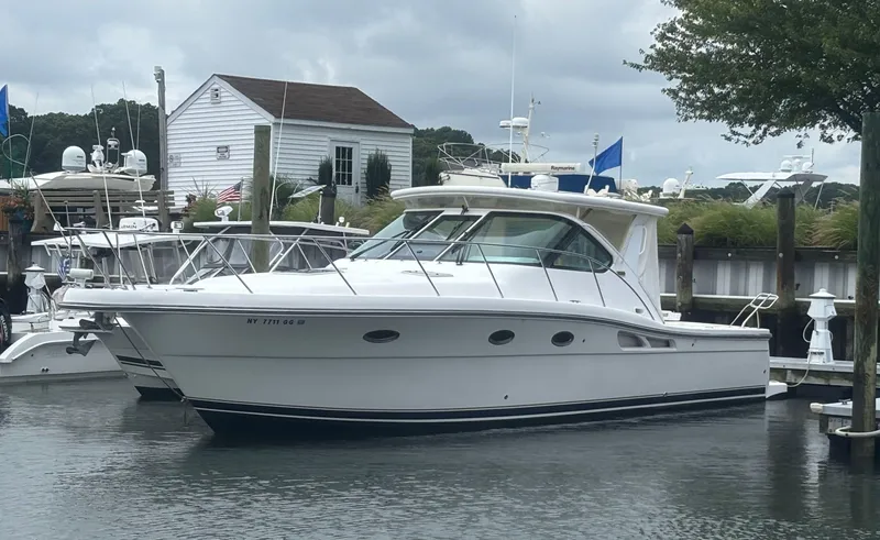 Slide: The Image of 2008 Tiara Yachts 3600 Open docked at a marina under cloudy skies. - 1