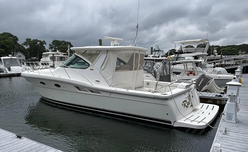 Slide: The Image of 2008 Tiara Yachts 3600 Open docked at marina under cloudy skies. - 2