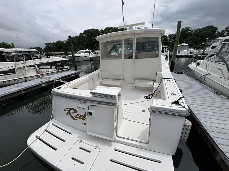 Slide: The Image of 2008 Tiara Yachts 3600 Open docked at marina, rear view. - 4
