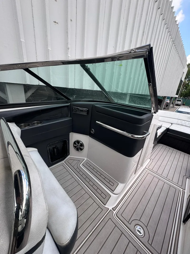 Slide: The Image of 2018 Regal 29 OBX boat interior with sleek seating and modern design. - 18