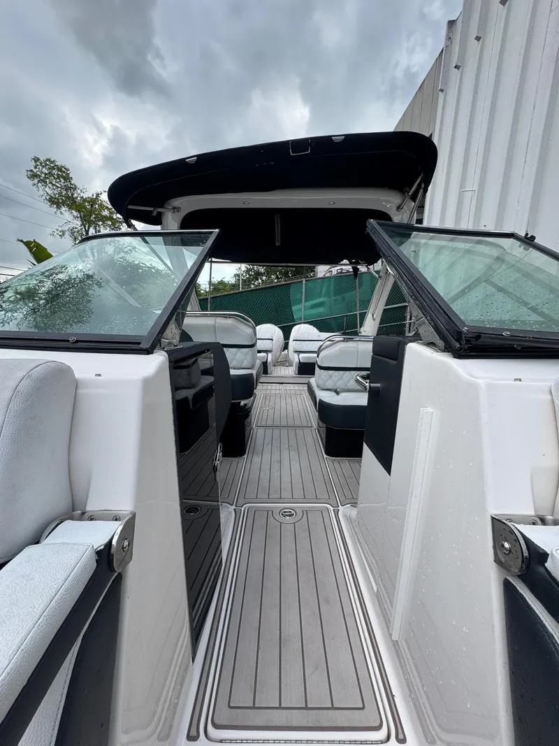 Slide: The Image of 2018 Regal 29 OBX boat interior with open seating and sleek design. - 24