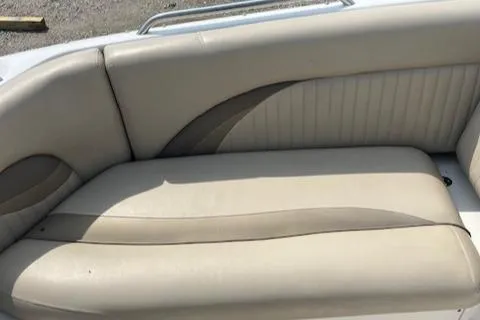 Slide: The Image of 2014 NauticStar 223DC Sport Deck boat seat with beige upholstery. - 14