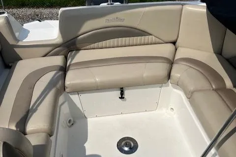 Slide: The Image of 2014 NauticStar 223DC Sport Deck boat interior with beige seating. - 15