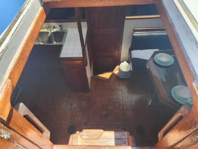 Slide: The Image of Interior view of 1978 Hardin Voyager 44 sailboat, featuring kitchen and dining area. - 3