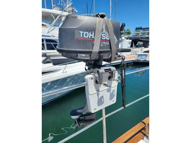 Slide: The Image of Outboard motor mounted on a 1978 Hardin Voyager 44 sailboat at a marina. - 34