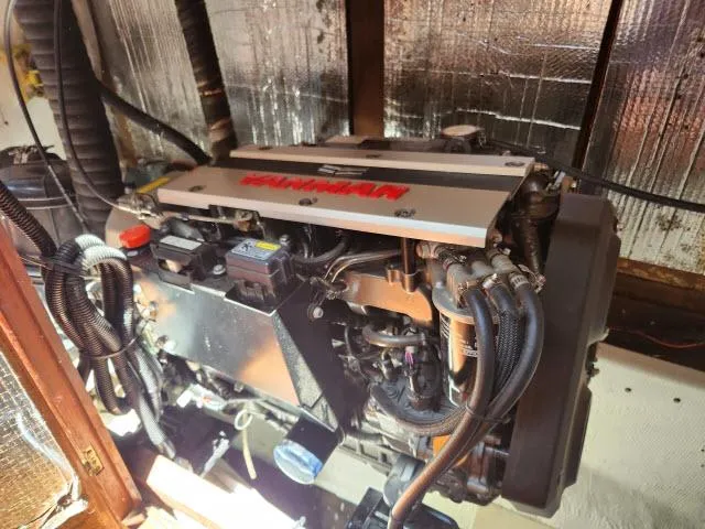 Slide: The Image of Engine of a 1978 Hardin Voyager 44 sailboat, featuring detailed components and wiring. - 36