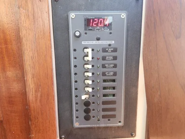 Slide: The Image of Electrical panel on 1978 Hardin Voyager 44 boat, displaying voltage and switches. - 39
