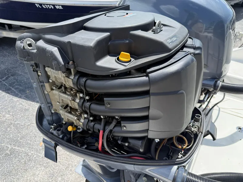 Slide: The Image of 2004 Triton 2690 WA boat engine, detailed view of motor components. - 16