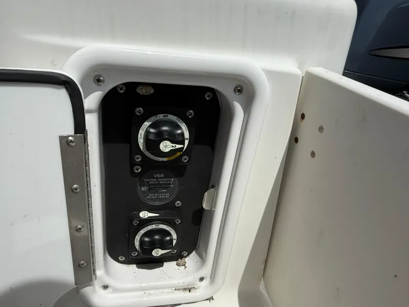Slide: The Image of 2004 Triton 2690 WA boat control panel with voltage sensitive relay module. - 21