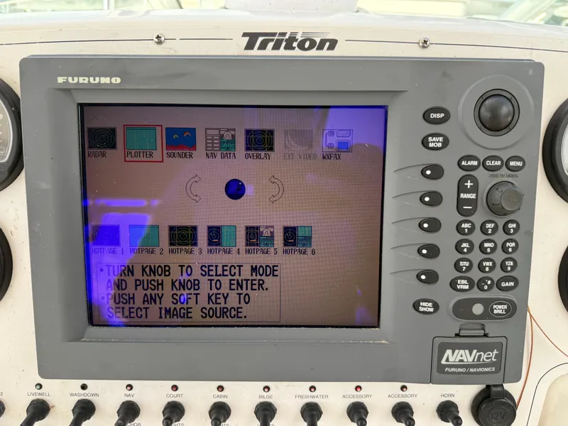 Slide: The Image of Furuno NAVnet display on 2004 Triton 2690 WA boat, showing navigation and radar options. - 34