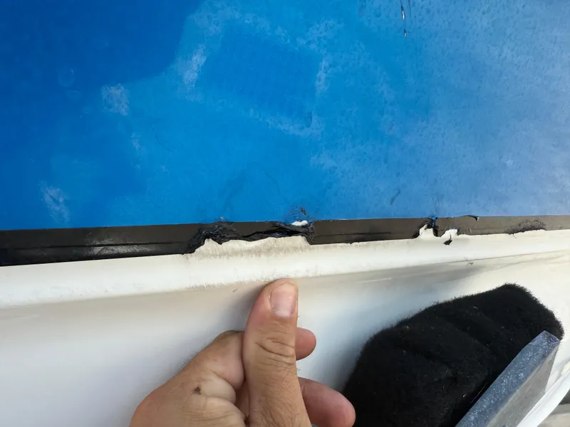 Slide: The Image of Close-up of damage on 2004 Triton 2690 WA boat hull. - 5