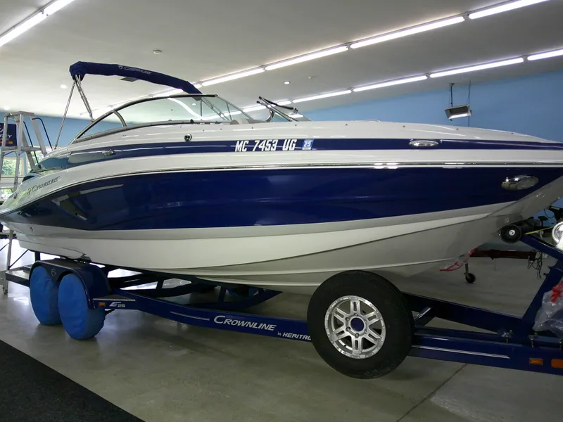 The Image of 2019 Crownline Eclipse E255 boat cruising on water with dealer warranty. - 0