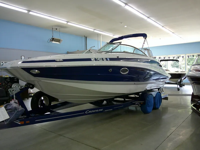 Slide: The Image of 2019 Crownline Eclipse E255 boat on trailer in showroom. - 1