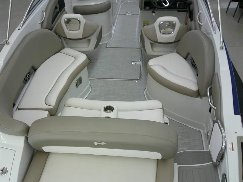 Slide: The Image of 2019 Crownline Eclipse E255 boat interior with beige and white seating. - 15