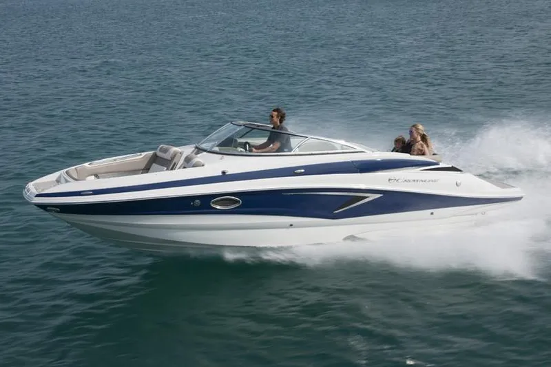 Slide: The Image of 2019 Crownline Eclipse E255 boat displayed indoors on a trailer. - 3