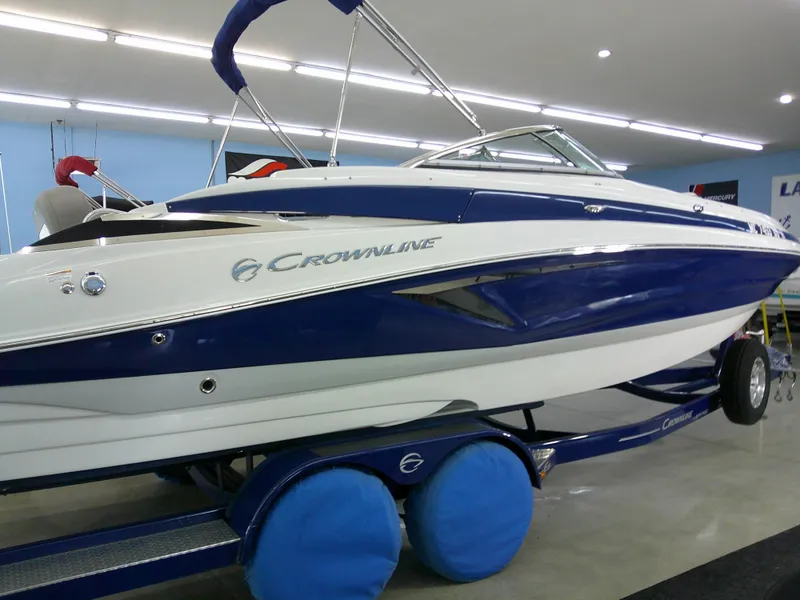 Slide: The Image of 2019 Crownline Eclipse E255 boat on display in showroom. - 4