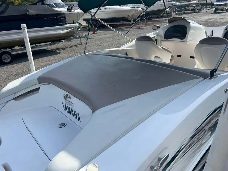 Slide: The Image of Yamaha LS 2000 boat, 2000 model, white exterior, docked with canopy. - 11