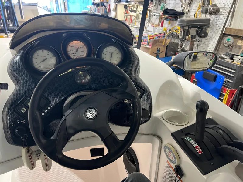 Slide: The Image of Yamaha Boats LS 2000 dashboard with steering wheel and controls, 2000 model. - 15