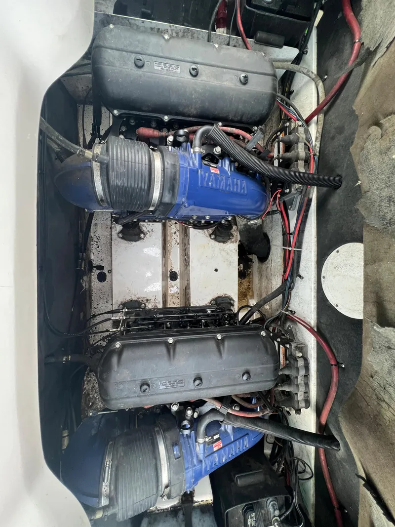 Slide: The Image of Engine compartment of a 2000 Yamaha Boats LS 2000, showing dual engines and wiring. - 20