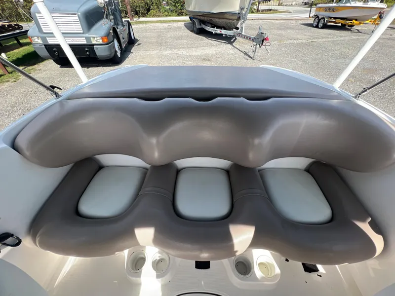 Slide: The Image of Yamaha Boats LS 2000, 2000 model, featuring cushioned seating in a parked boat setting. - 8