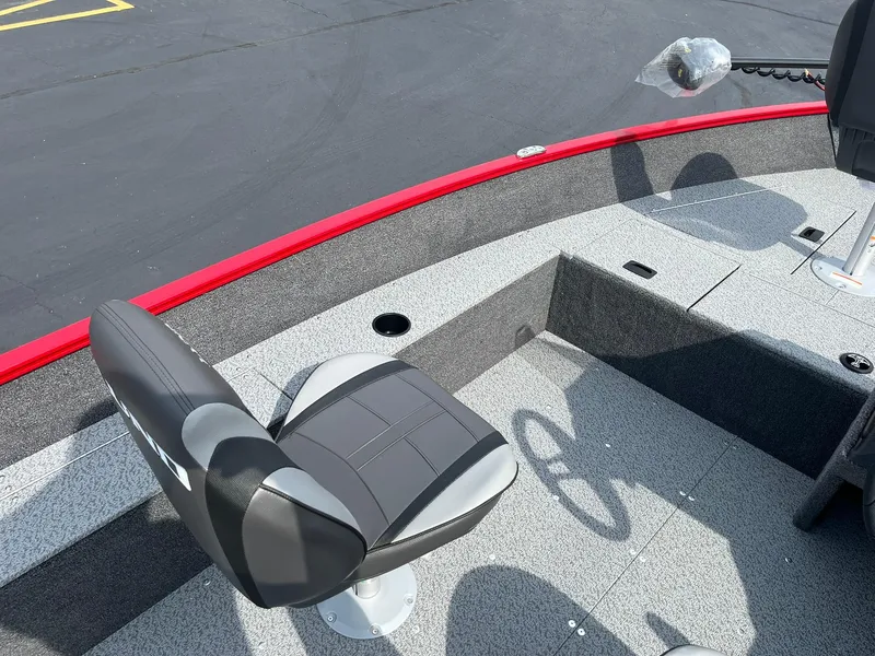 Slide: The Image of 2026 Lund 1650 Angler SS boat interior with seating and steering wheel. - 29