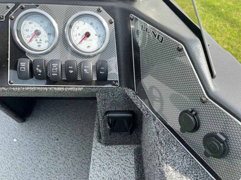 Slide: The Image of Dashboard of 2026 Lund 1650 Angler SS boat with gauges and switches. - 34