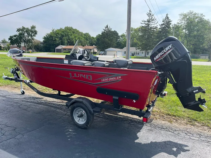 Slide: The Image of 2026 Lund 1650 Angler SS boat with Mercury outboard motor on trailer. - 40