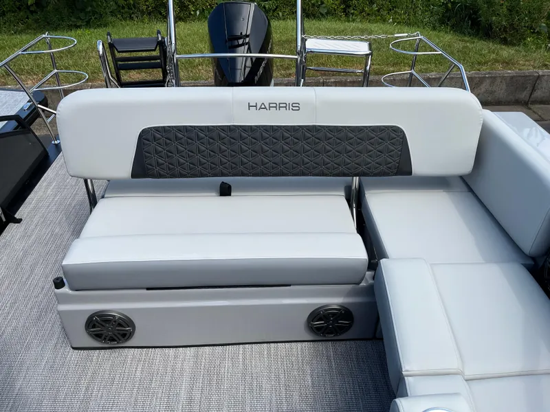 Slide: The Image of 2026 Harris Solstice 250 boat interior with plush seating and modern design. - 10