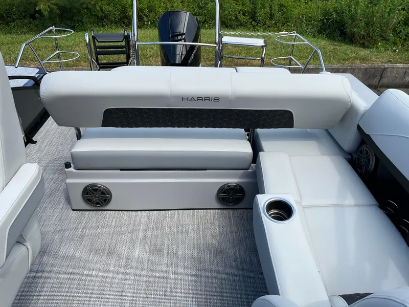 Slide: The Image of 2026 Harris Solstice 250 boat interior with plush seating and cup holders. - 11