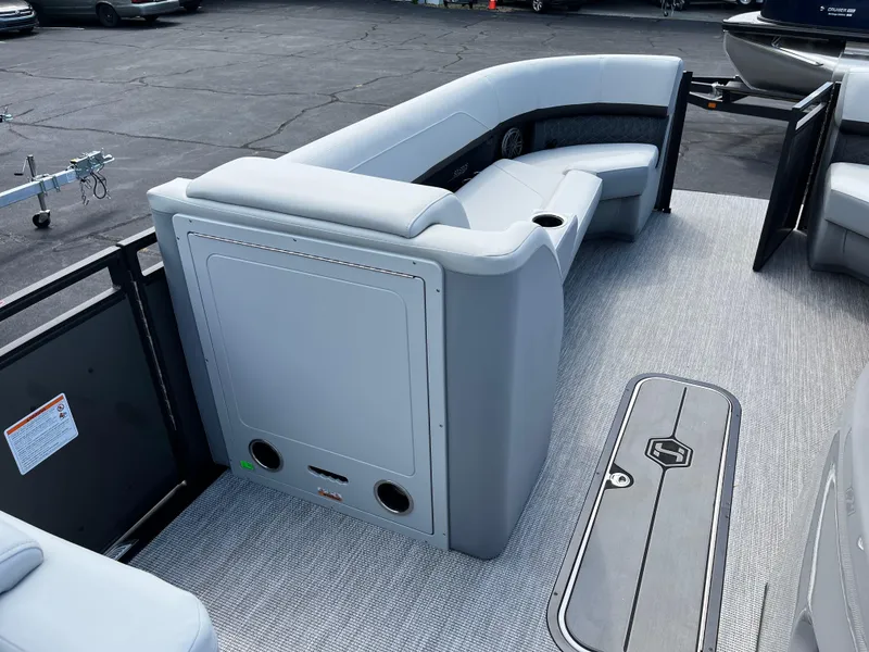 Slide: The Image of 2026 Harris Solstice 250 boat interior with gray seating and flooring. - 13