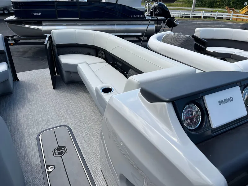 Slide: The Image of 2026 Harris Solstice 250 pontoon boat interior with luxurious seating and Simrad electronics. - 14
