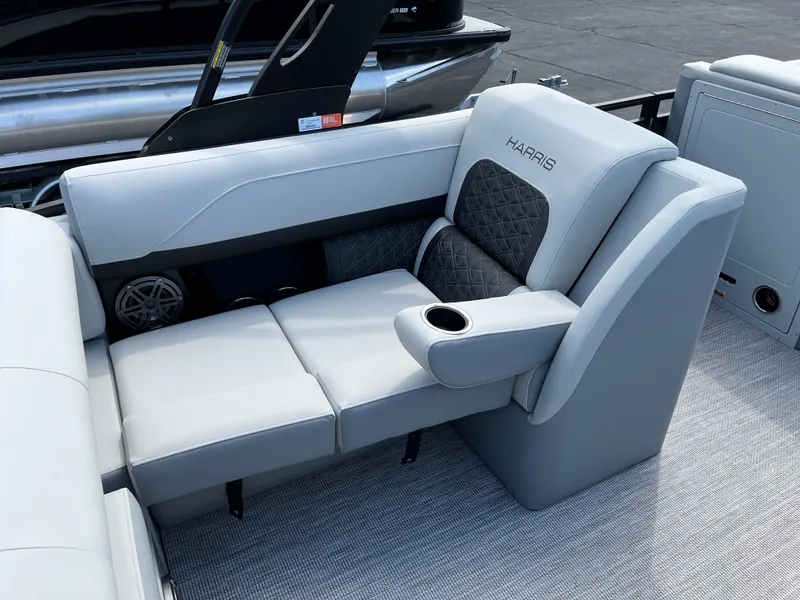 Slide: The Image of Luxurious seating on 2026 Harris Solstice 250 pontoon boat with cup holder and speaker. - 16