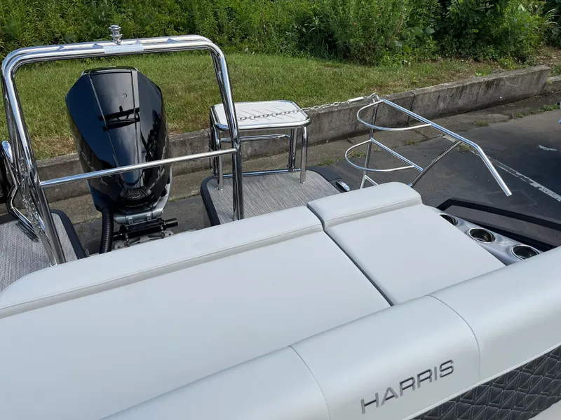 Slide: The Image of 2026 Harris Solstice 250 boat with sleek design and powerful outboard motor. - 9
