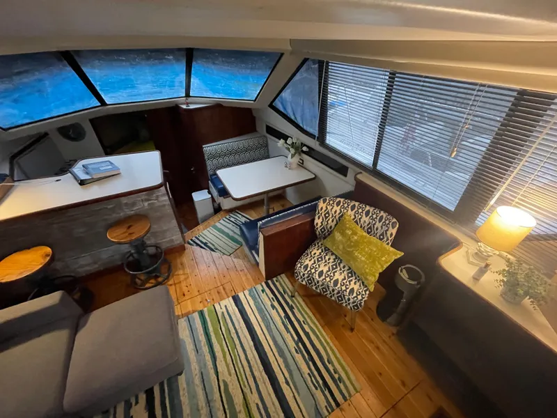 Slide: The Image of Interior of 1992 Carver 33 Aft Cabin MY with cozy seating and modern decor. - 11