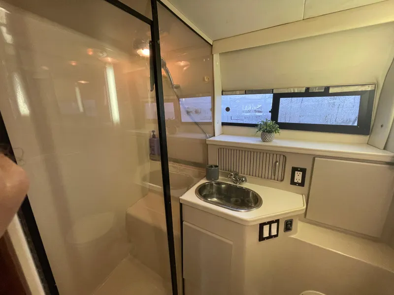 Slide: The Image of Bathroom interior of 1992 Carver 33 Aft Cabin MY with sink and shower. - 30