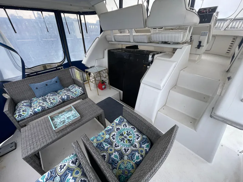 Slide: The Image of 1992 Carver 33 Aft Cabin Motor Yacht helm with Garmin navigation and control instruments. - 33