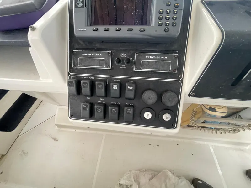 Slide: The Image of Control panel of a 1992 Carver 33 Aft Cabin MY with Volvo Penta switches. - 38
