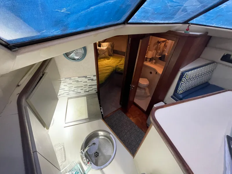 Slide: The Image of Interior of 1992 Carver 33 Aft Cabin MY with kitchen, bathroom, and bedroom. - 41
