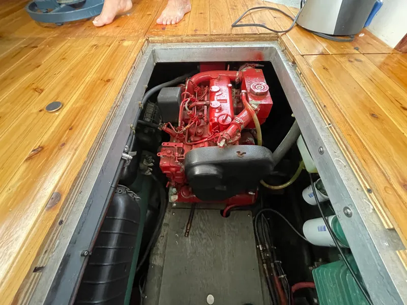Slide: The Image of Engine compartment of a 1992 Carver 33 Aft Cabin MY with visible red engine. - 48