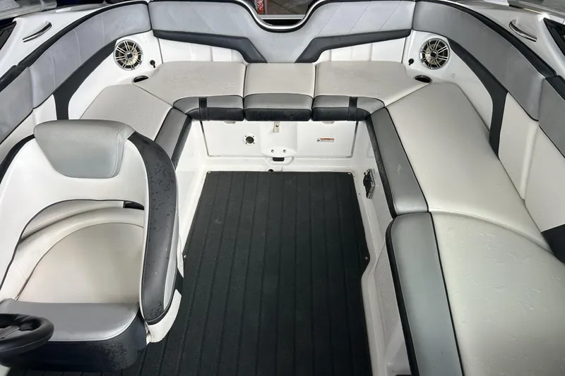 Slide: The Image of Interior of 2013 Yamaha Boats 212 X, featuring sleek seating and modern design. - 4