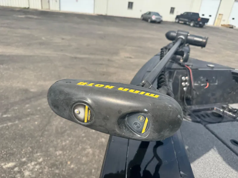 Slide: The Image of 2023 Ranger VX1888 WT boat interior with gray and red seat, carpeted deck, and cup holders. - 13